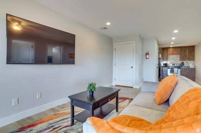 217 West Terrace Circle Toquerville, UT 84774 - Photo 14 of 25 Living area with light wood finished floors and recessed lighting