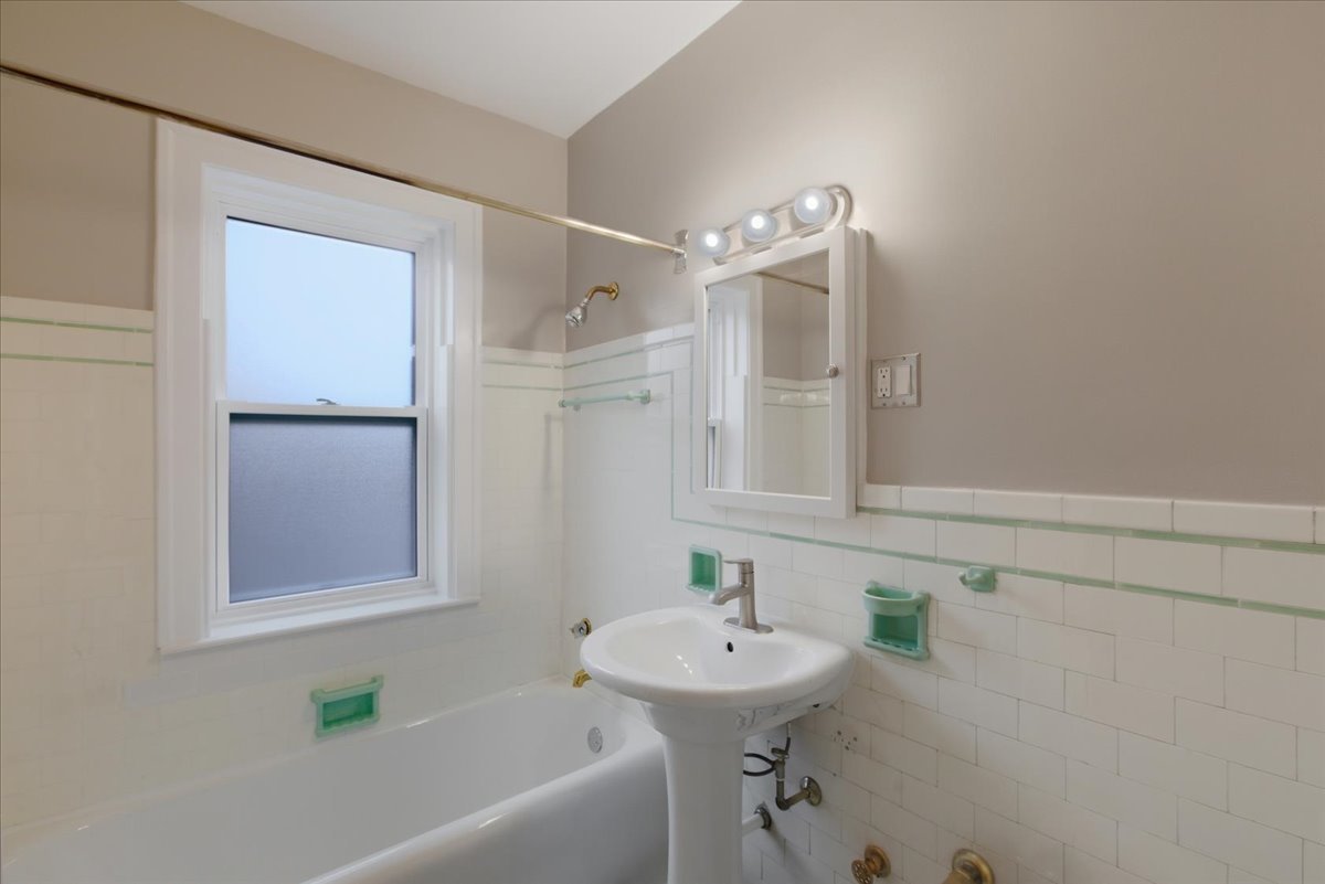 1507 Dobson Street, Unit 3 Evanston, IL 60202 - Photo 12 of 14 a bathroom with a sink and a bathtub