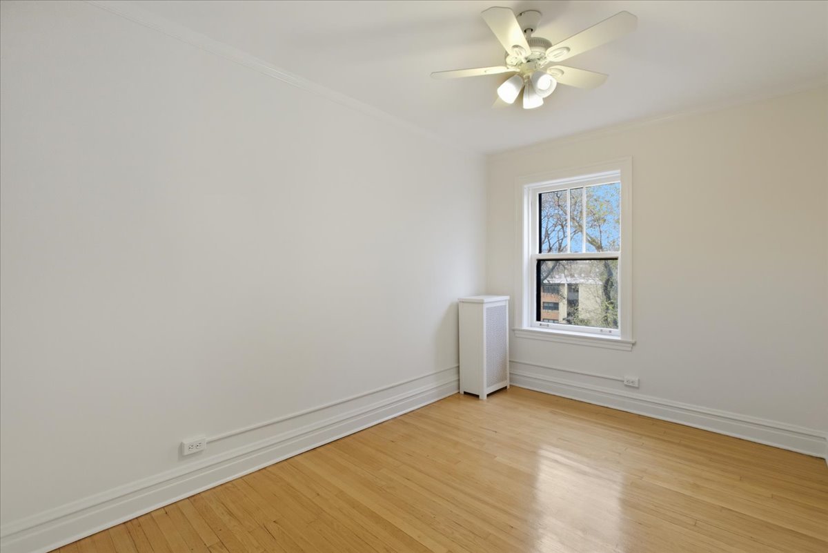 1507 Dobson Street, Unit 3 Evanston, IL 60202 - Photo 13 of 14 an empty room with a window and a fan