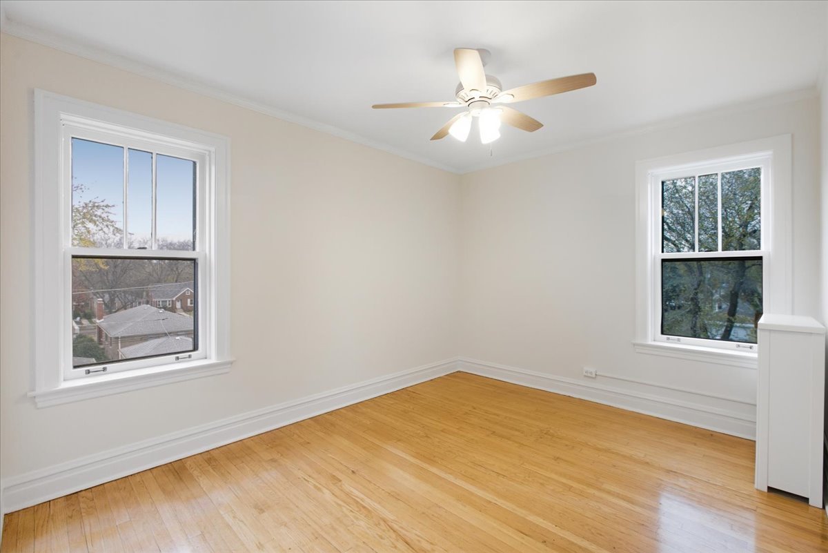 1507 Dobson Street, Unit 3 Evanston, IL 60202 - Photo 14 of 14 a view of an empty room with a window and wooden floor