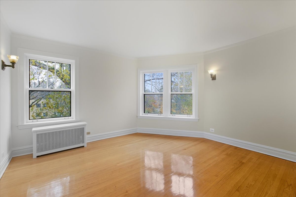 1507 Dobson Street, Unit 3 Evanston, IL 60202 - Photo 2 of 14 an empty room with windows
