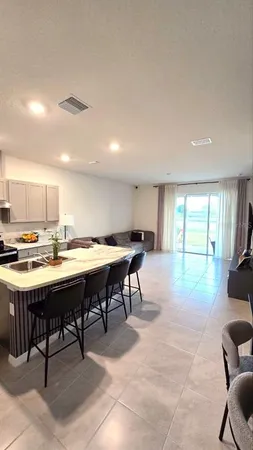 a view of a dining room with furniture window and outside view