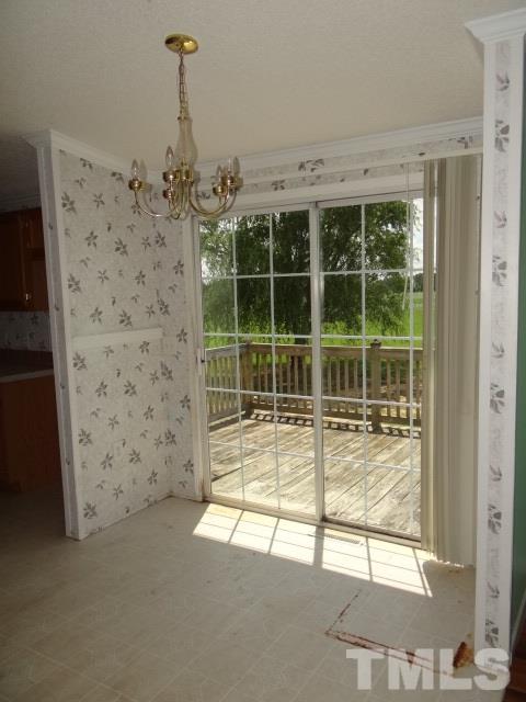 6393 Nichols Rd Spring Spring Hope, NC 27882 - Photo 7 of 15 a view of a glass door with a glass door