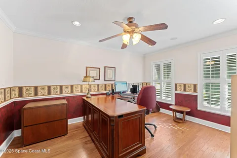 a utility room with cabinets washer and dryer
