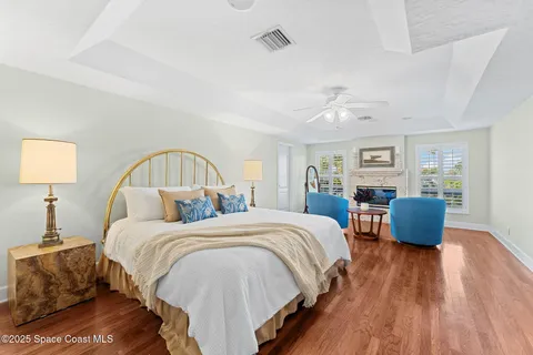 a view of a ocean with boats and palm trees