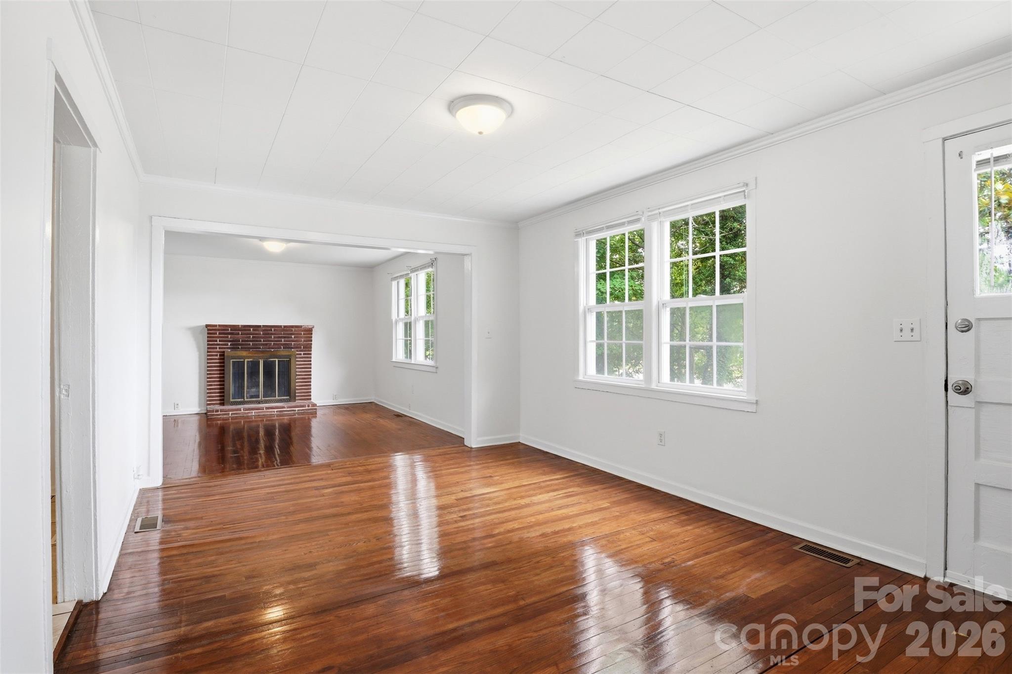 128 Ella Street Chester, SC 29706 - Photo 13 of 18 a view of empty room with wooden floor and fan