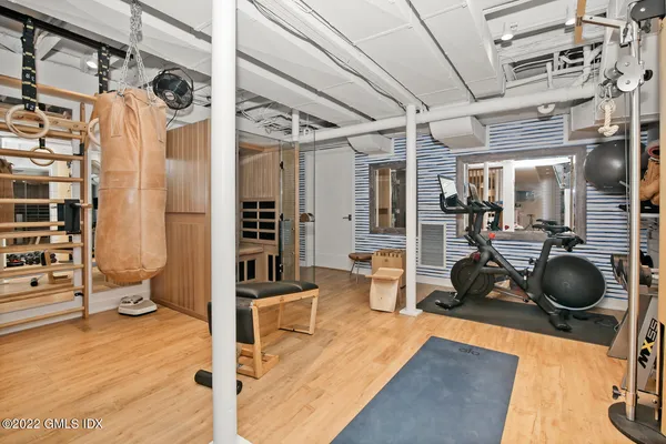 a gym room with lots of gym equipment