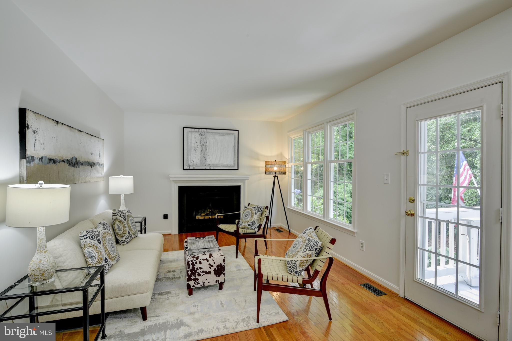 11600 Springhouse Place Reston, VA 20194 - Photo 8 of 28 Gas Fireplace in Family Room, French Door to Deck.