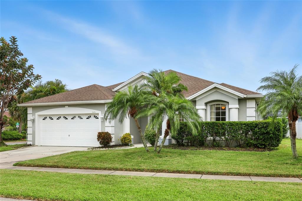 2601 Roughside Circle Kissimmee, FL 34746 - Photo 1 of 1 a front view of a house with a garden