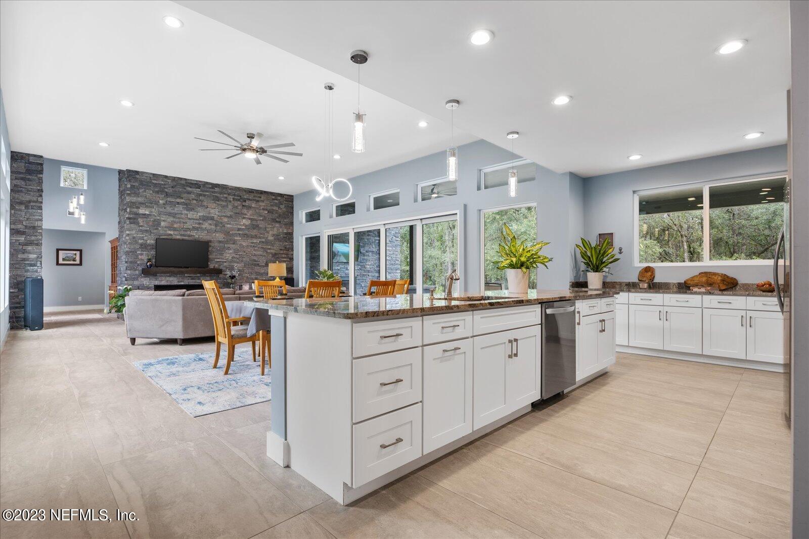 13535 Settindown Drive Bryceville, FL 32009 - Photo 20 of 59 a large white kitchen with a large window and counter space