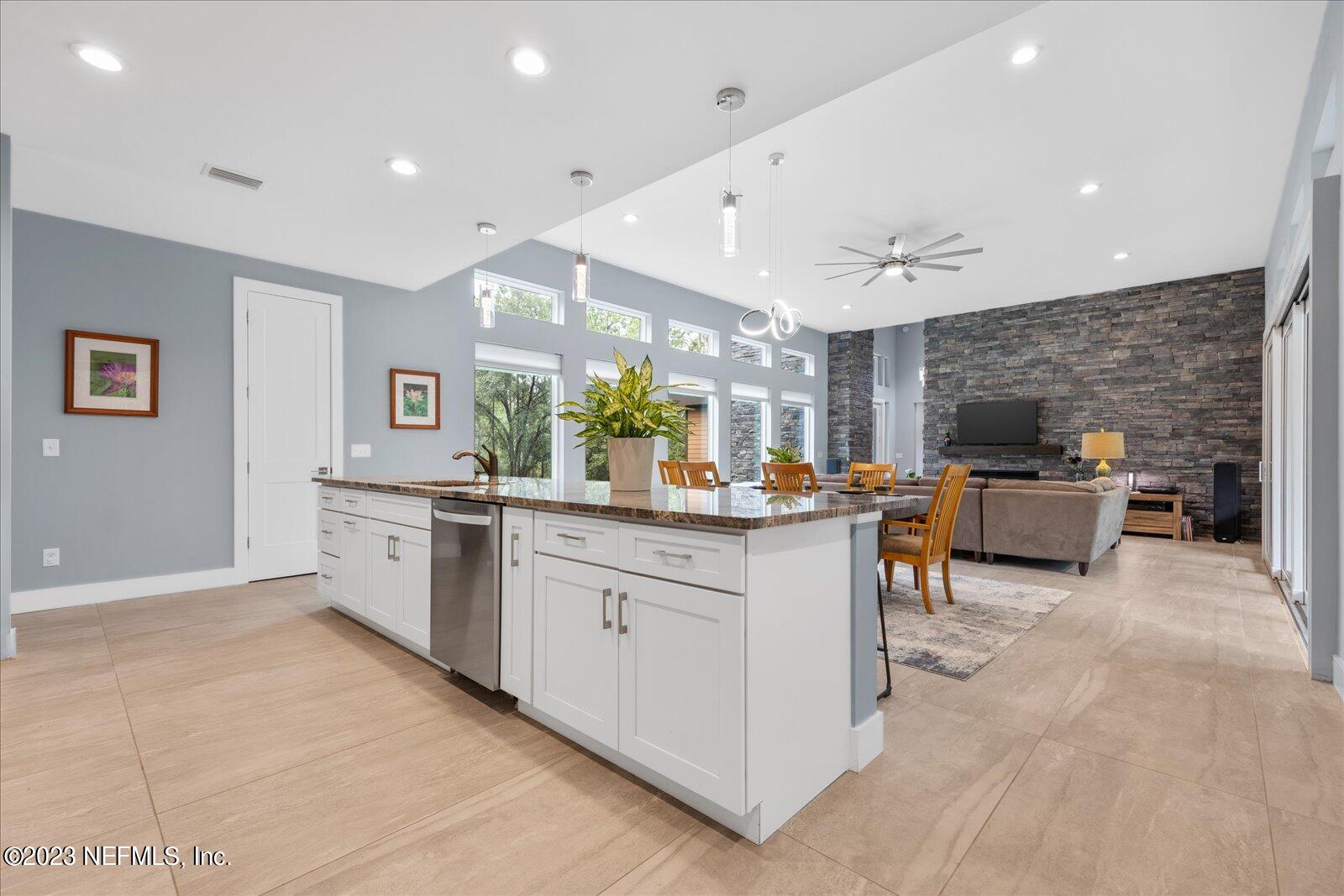 13535 Settindown Drive Bryceville, FL 32009 - Photo 21 of 59 a large white kitchen with a large window