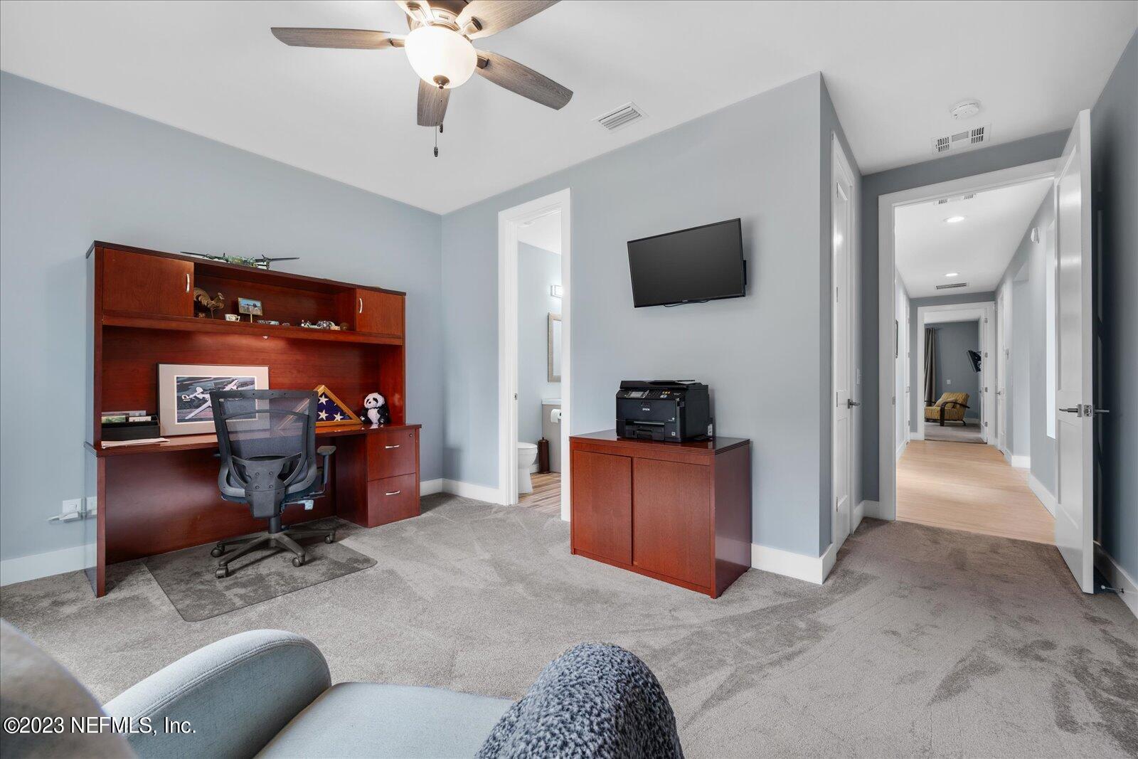 13535 Settindown Drive Bryceville, FL 32009 - Photo 37 of 59 a view of a livingroom with workspace and a couch
