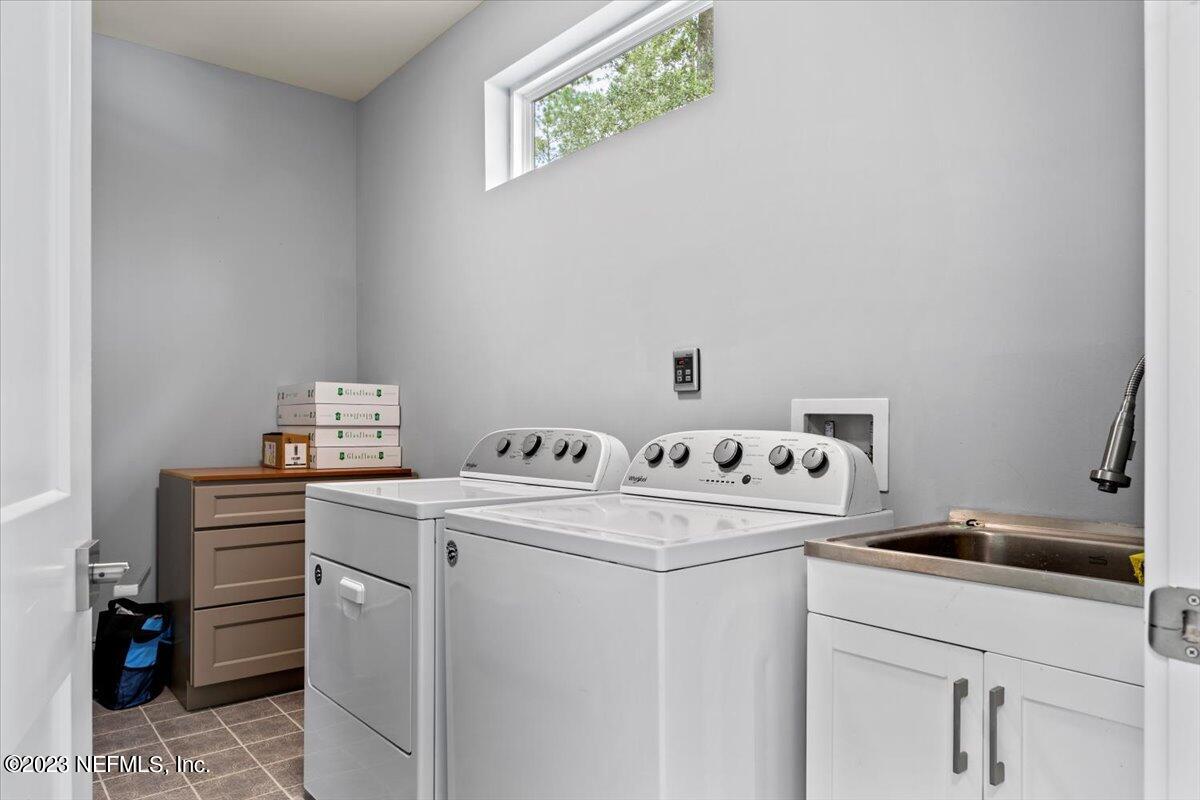 13535 Settindown Drive Bryceville, FL 32009 - Photo 44 of 59 a utility room with dryer and washer