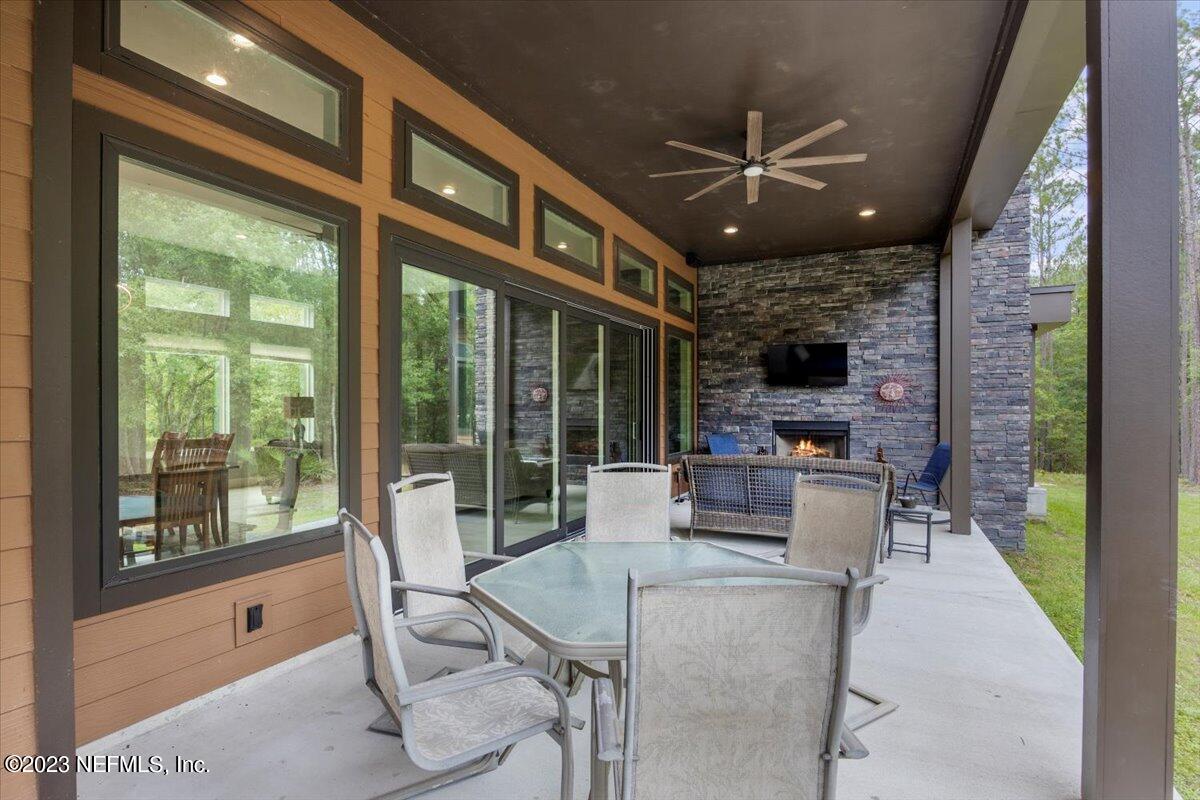 13535 Settindown Drive Bryceville, FL 32009 - Photo 45 of 59 a dining room with furniture and large windows