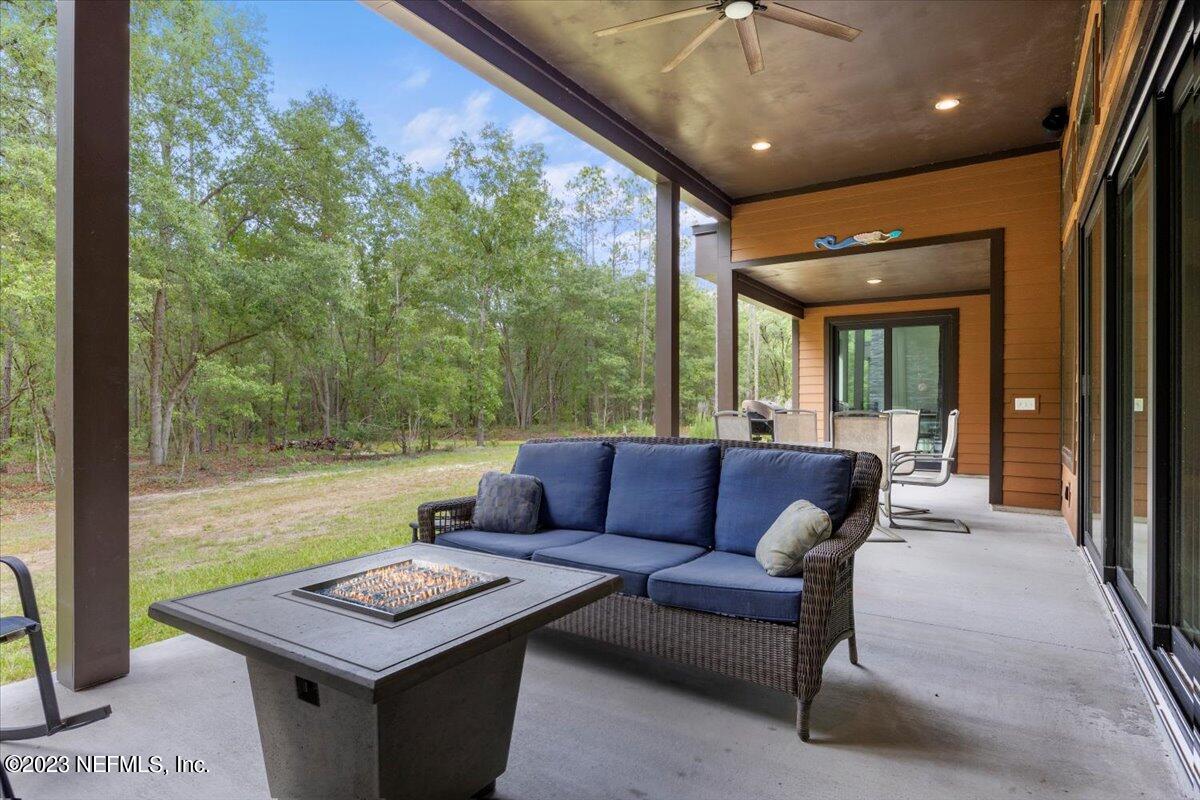 13535 Settindown Drive Bryceville, FL 32009 - Photo 47 of 59 a outdoor living space with furniture and a potted plant