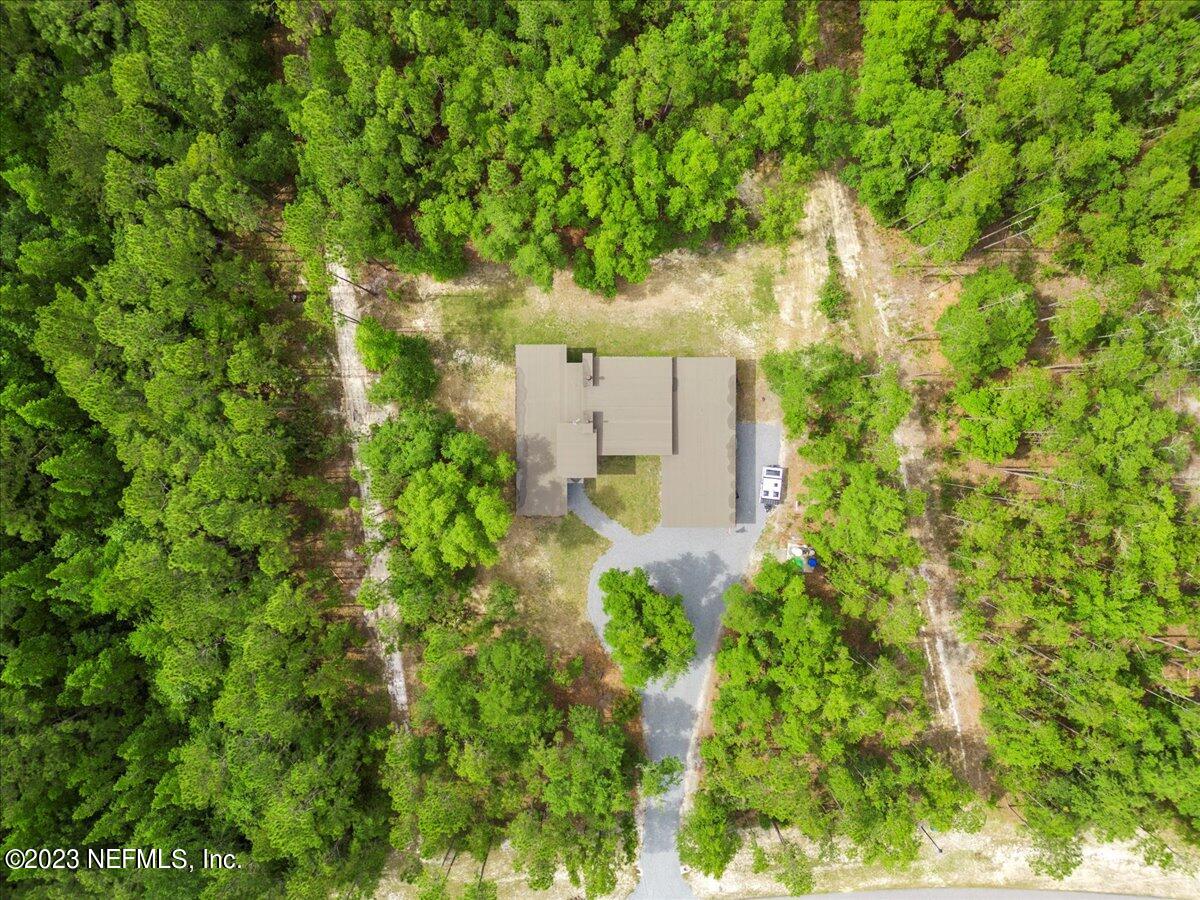 13535 Settindown Drive Bryceville, FL 32009 - Photo 51 of 59 an aerial view of a house with a yard