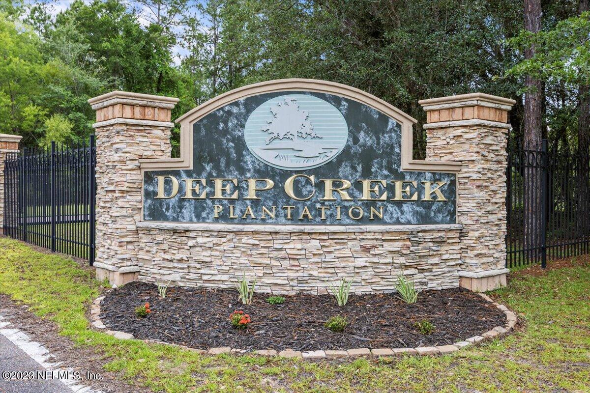 13535 Settindown Drive Bryceville, FL 32009 - Photo 56 of 59 a front view of a house with garden