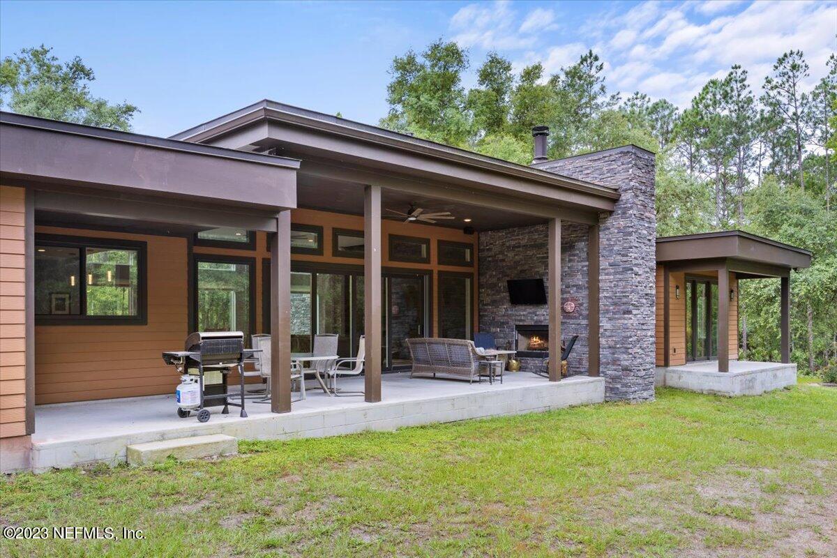 13535 Settindown Drive Bryceville, FL 32009 - Photo 7 of 59 a view of a chair and table in front of house