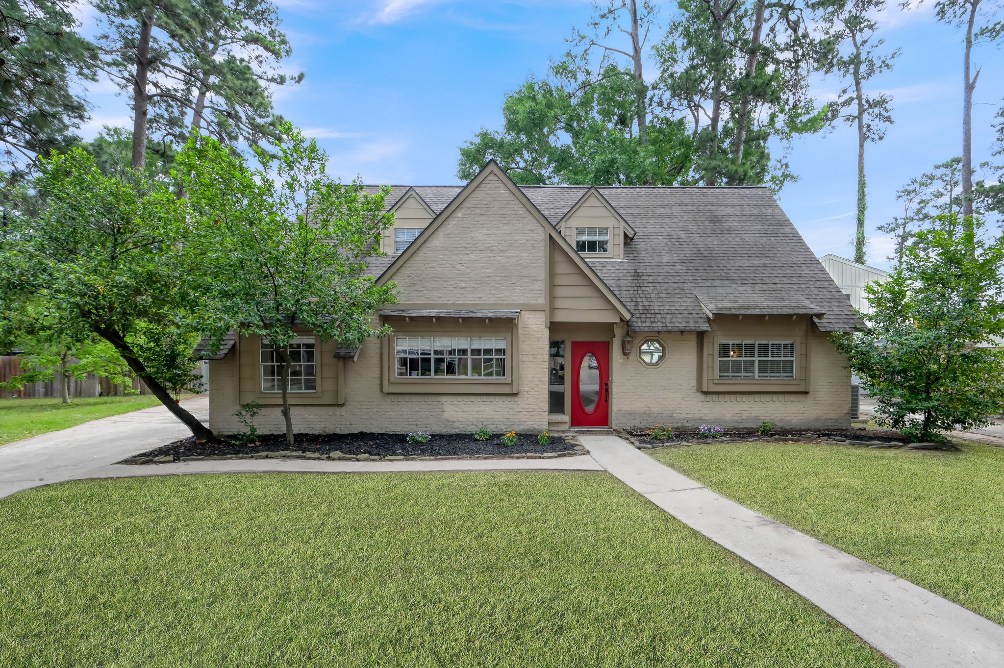 25610 Walnut Grove Circle Spring, TX 77380 - Photo 1 of 29 a view of an house with backyard space and tree