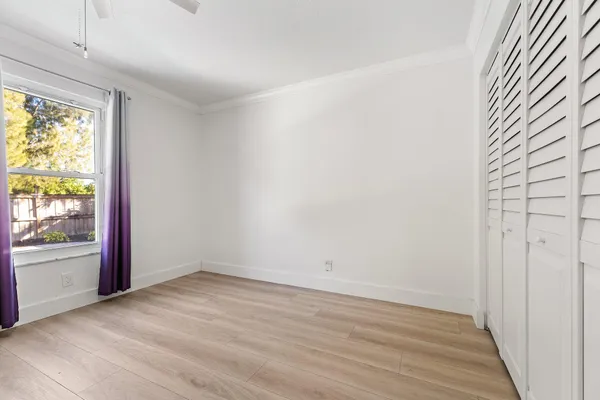 an empty room with wooden floor