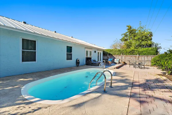 a view of a swimming pool with a patio