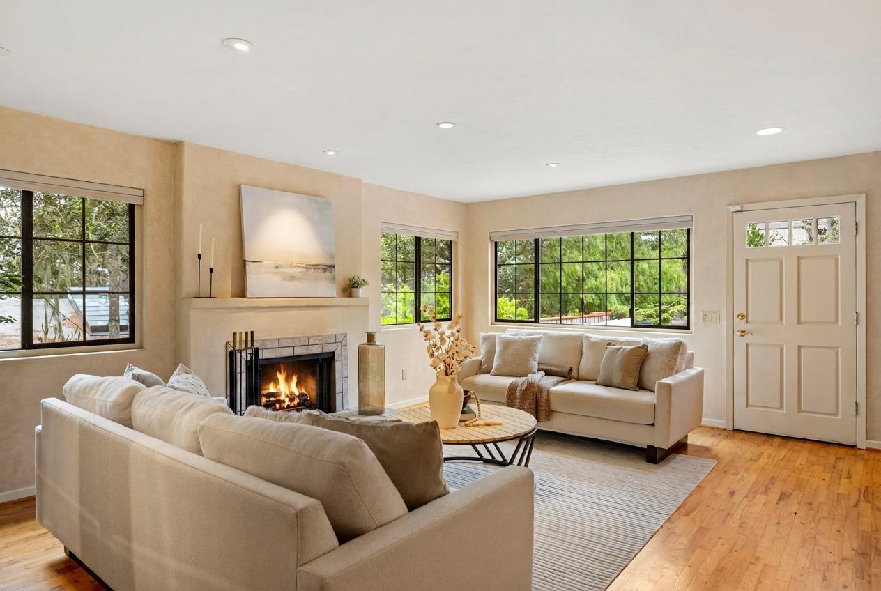 777 Parcel Street Monterey, CA 93940 - Photo 4 of 21 a living room with furniture and a fireplace