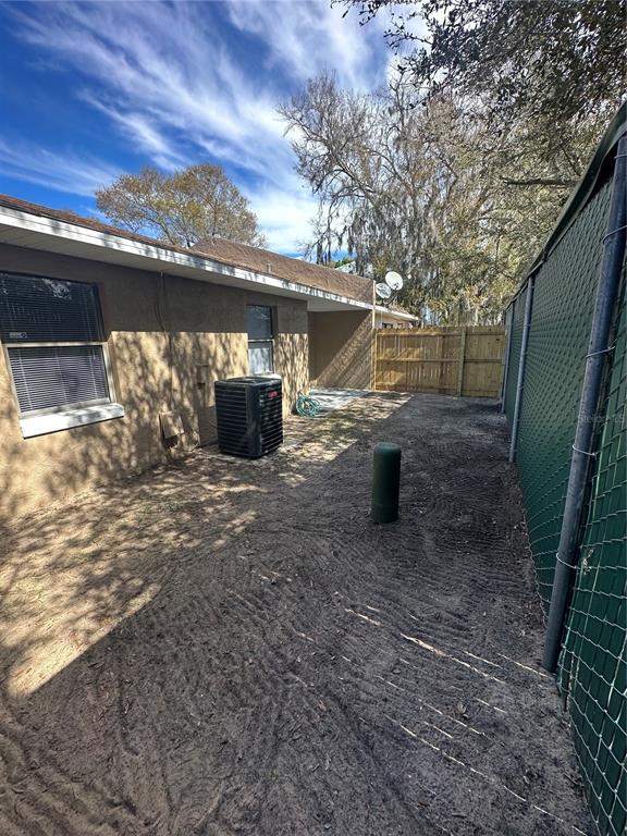 185 Lakeside Hills Loop Auburndale, FL 33823 - Photo 25 of 26 a view of a wooden door and outdoor space