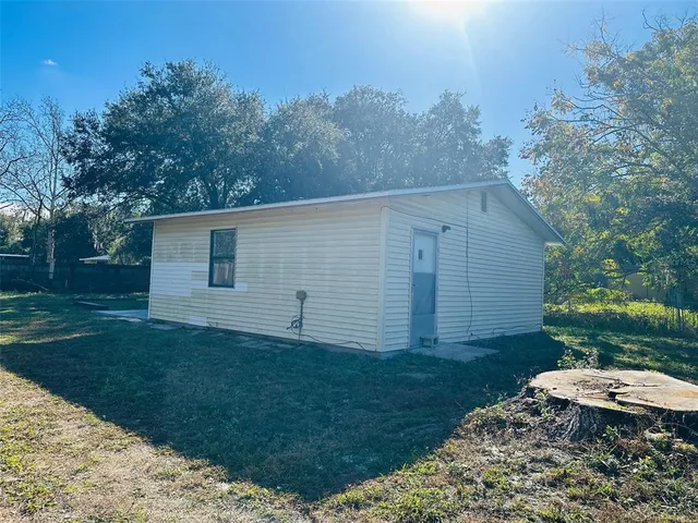 a backyard of a house with lots of green space
