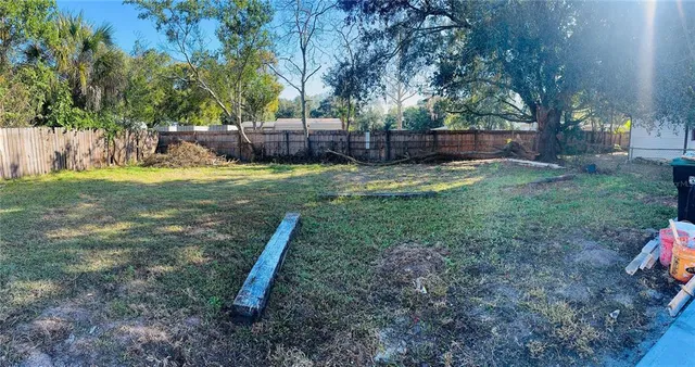 a view of a backyard with swings