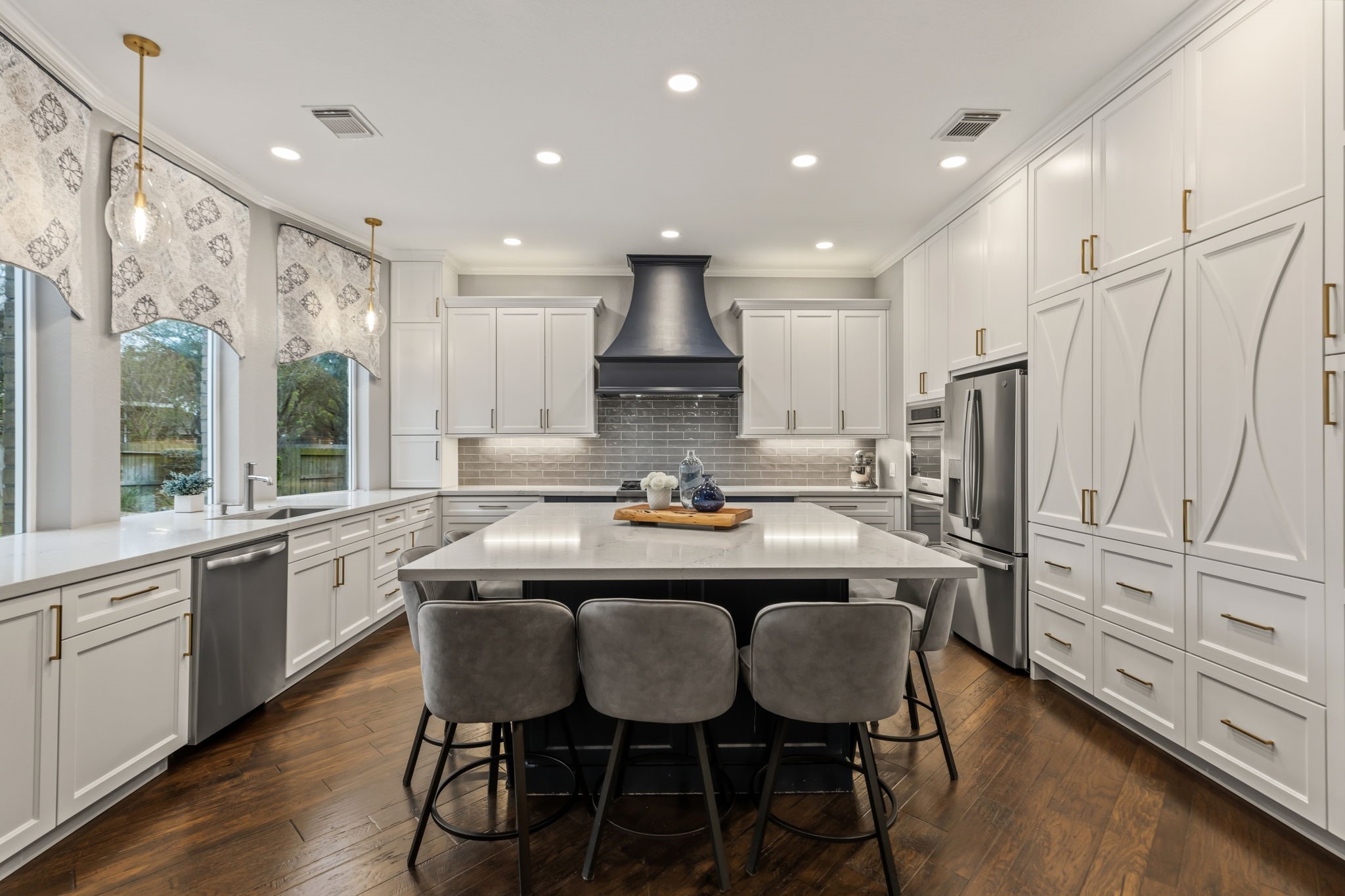 20102 Windbury Court Spring, TX 77379 - Photo 14 of 49 a kitchen with stainless steel appliances granite countertop a table chairs sink refrigerator and microwave