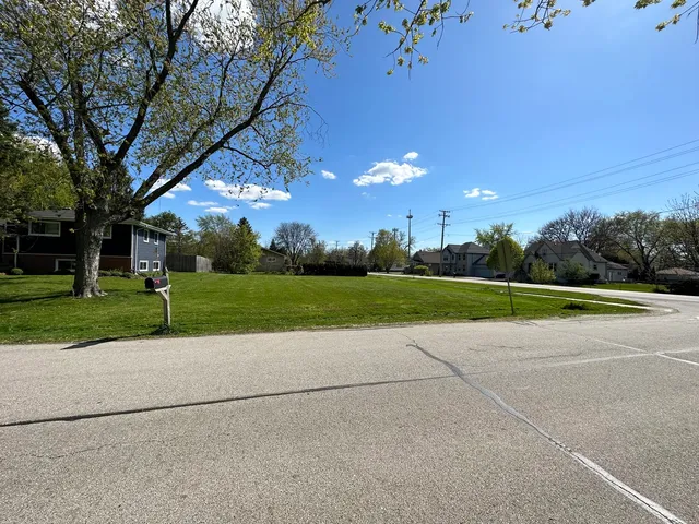 a view of a playground with basketball court