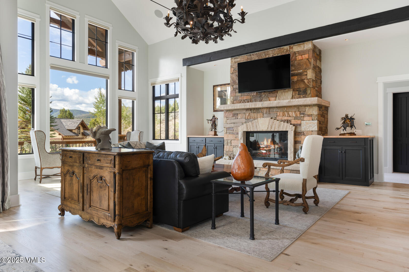 130 Fall Creek Road Edwards, CO 81632 - Photo 15 of 52 a living room with furniture a fireplace and a flat screen tv
