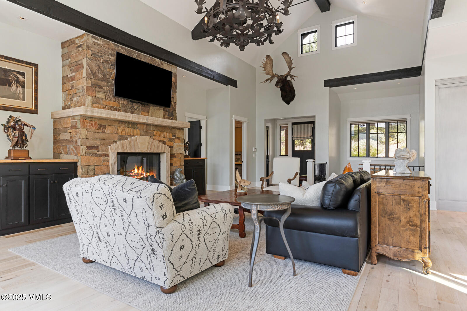130 Fall Creek Road Edwards, CO 81632 - Photo 20 of 52 a living room with furniture a fireplace and a flat screen tv