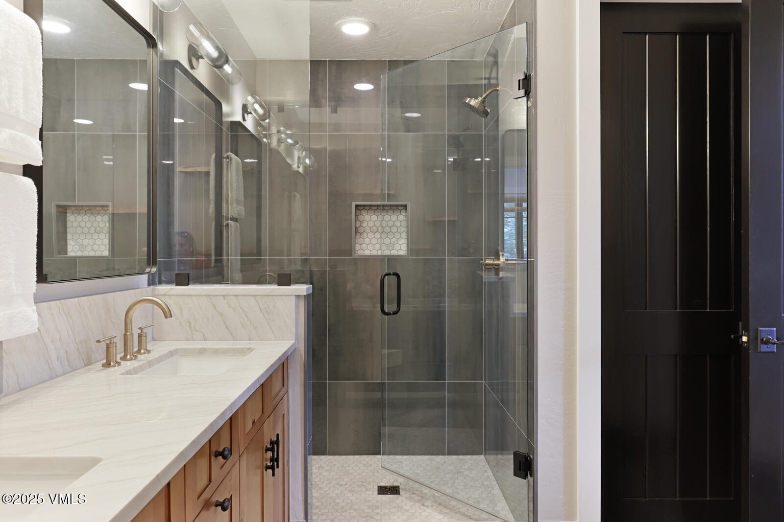 130 Fall Creek Road Edwards, CO 81632 - Photo 29 of 52 a bathroom with a shower sink and mirror