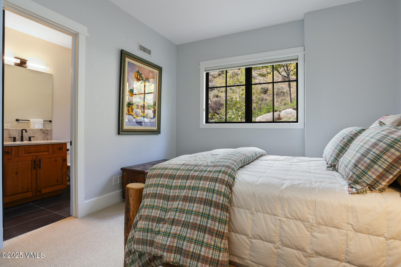 130 Fall Creek Road Edwards, CO 81632 - Photo 33 of 52 a bedroom with a bed and a window