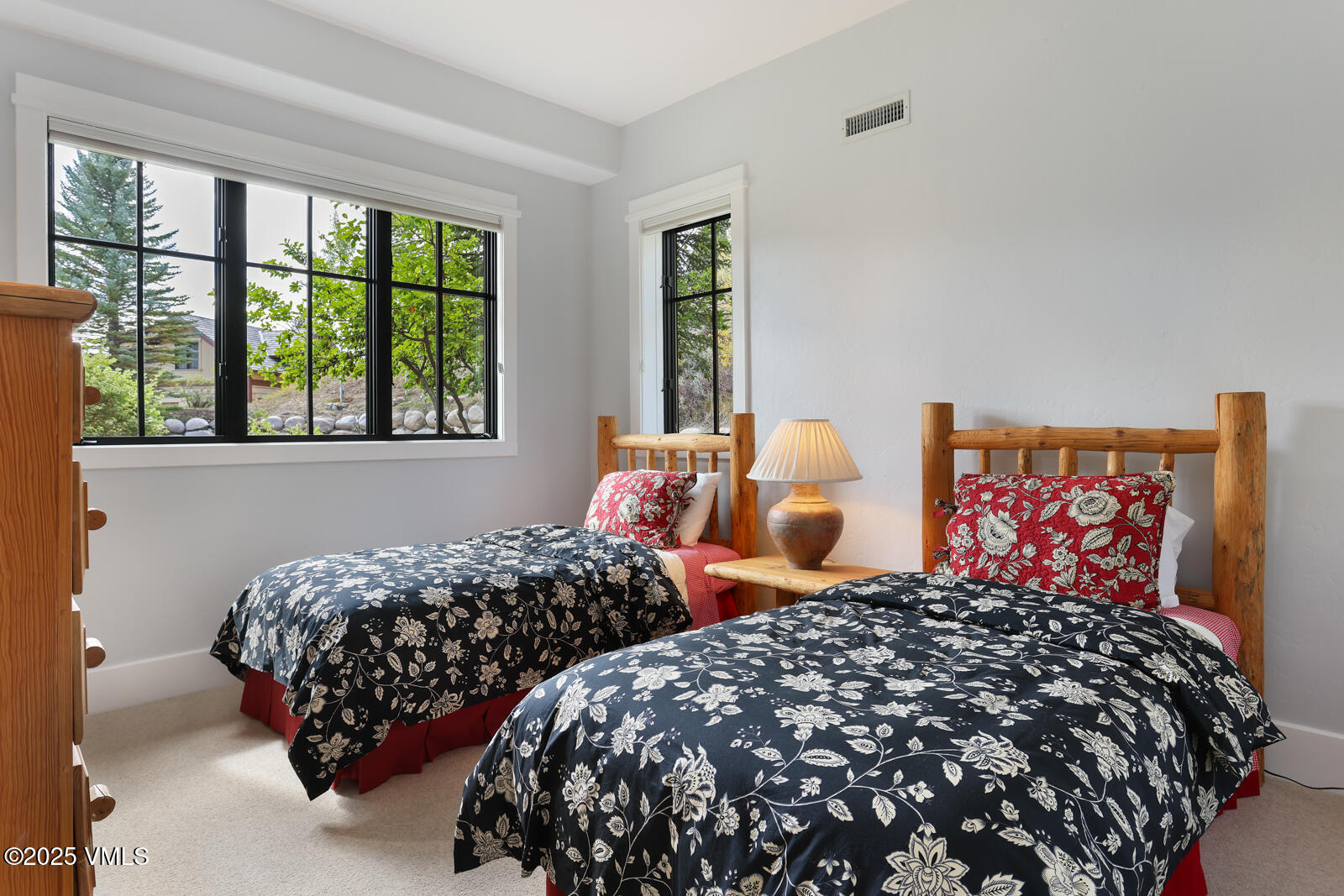 130 Fall Creek Road Edwards, CO 81632 - Photo 35 of 52 a bedroom with two beds and a large window