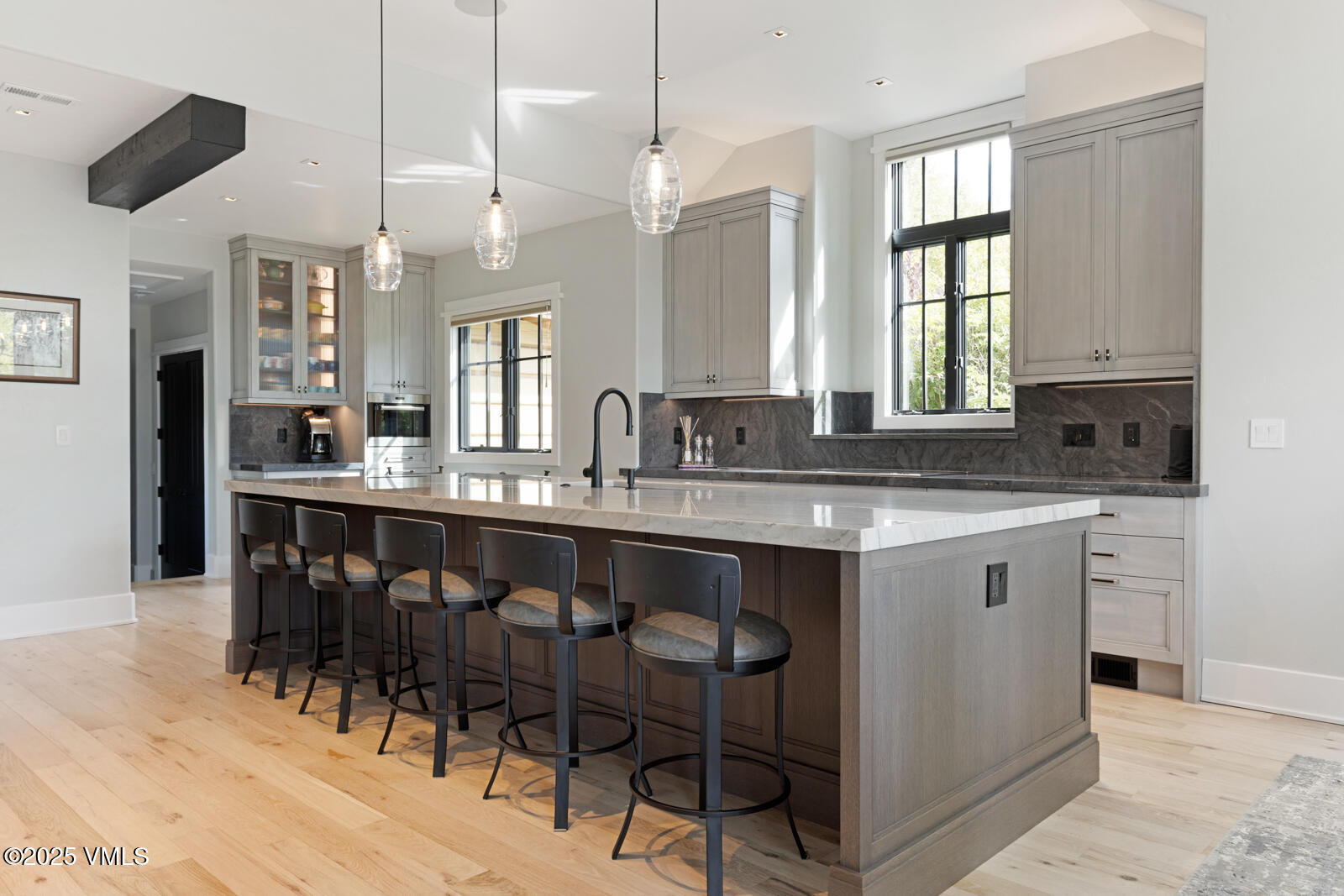 130 Fall Creek Road Edwards, CO 81632 - Photo 6 of 52 a kitchen with stainless steel appliances granite countertop a sink a stove a dining table and chairs