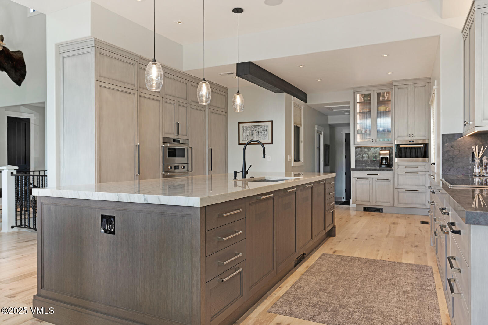 130 Fall Creek Road Edwards, CO 81632 - Photo 7 of 52 a large kitchen with kitchen island a large counter top space a sink stainless steel appliances and cabinets