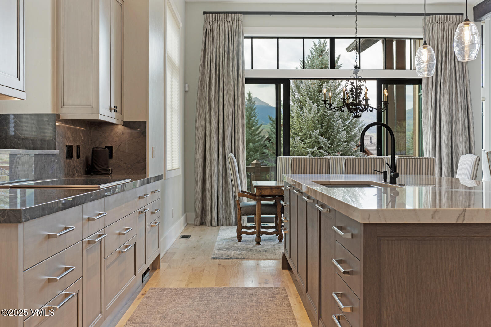 130 Fall Creek Road Edwards, CO 81632 - Photo 8 of 52 a kitchen with white cabinets and a sink