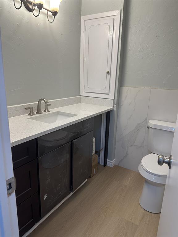 3417 Blue Ridge Lane Garland, TX 75042 - Photo 8 of 9 a bathroom with a sink and a toilet