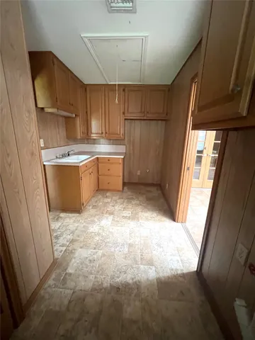 a view of a kitchen with furniture and a window