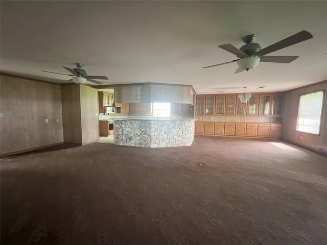 a view of a kitchen with a sink and a window