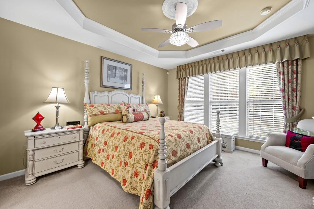 1081 Spring Station Road Greensboro, GA 30642 - Photo 18 of 35 a spacious bedroom with a bed and a couch