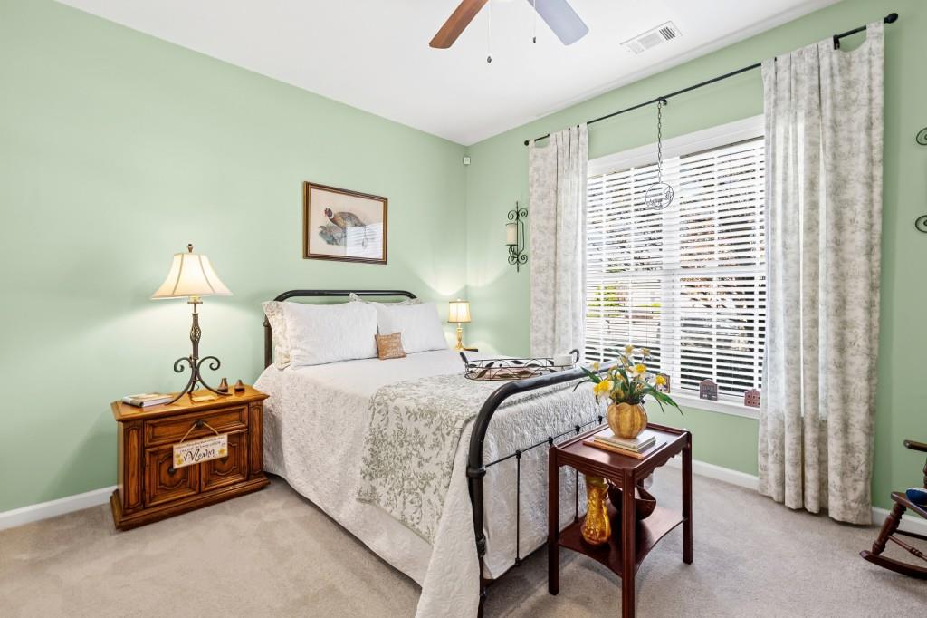 1081 Spring Station Road Greensboro, GA 30642 - Photo 24 of 35 a bedroom with a bed and a window