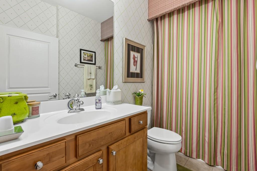 1081 Spring Station Road Greensboro, GA 30642 - Photo 27 of 35 a bathroom with a sink a toilet and mirror