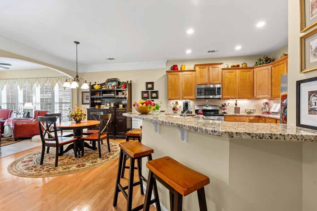 1081 Spring Station Road Greensboro, GA 30642 - Photo 10 of 35 a kitchen with a table chairs stove and cabinets