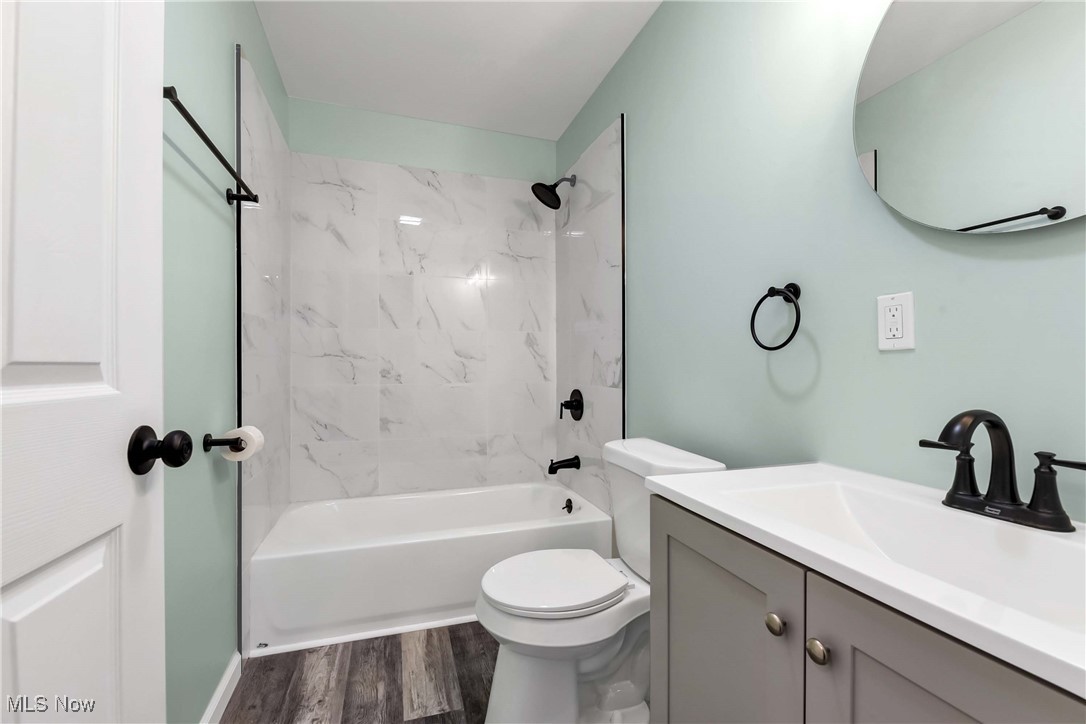 2022 Rohde Street Sandusky, OH 44870 - Photo 24 of 29 Full bathroom with vanity, toilet, and tiled shower / bath