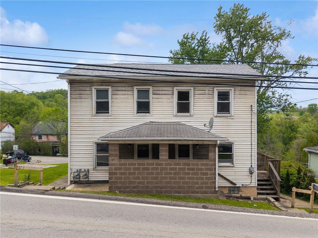 680 Main Street Irwin, PA 15642 - Photo 1 of 41 a front view of a house with a yard