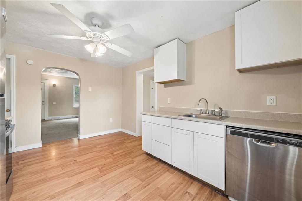 680 Main Street Irwin, PA 15642 - Photo 20 of 41 a kitchen with stainless steel appliances granite countertop a sink and a refrigerator