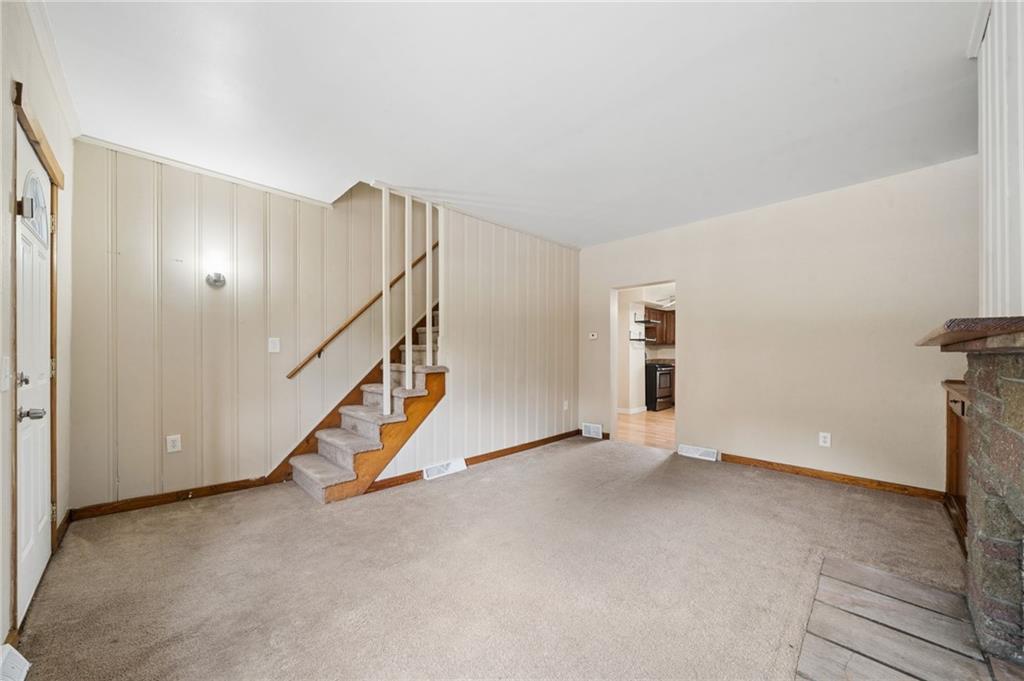 680 Main Street Irwin, PA 15642 - Photo 9 of 41 a view of an empty room with stairs